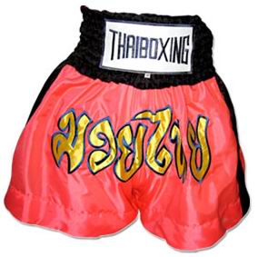Red Muay Thai shorts with a black waistband and large lettering on the front